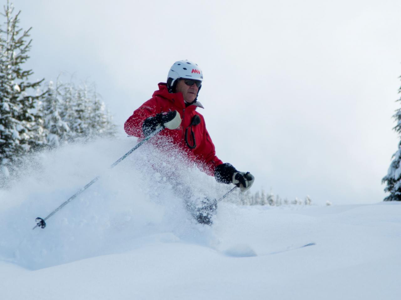 Mike Wiegele powder skiing on Saddle Mountain